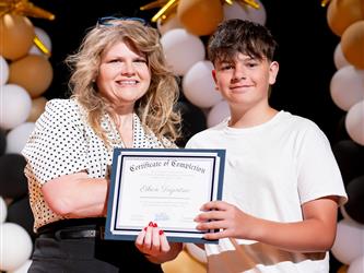 student receiving their certificate