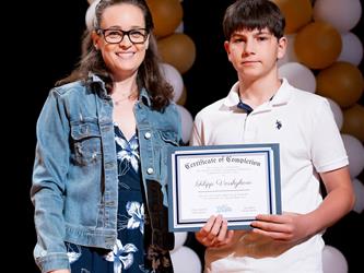 student receiving their certificate