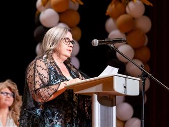 woman speaking at podium