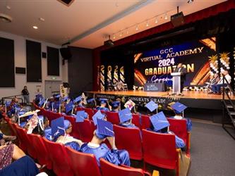 rear shot of students facing stage