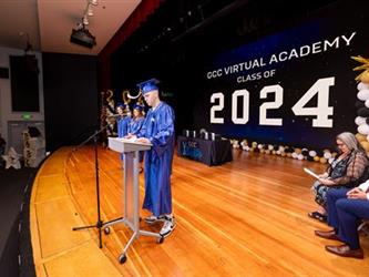 student speaking on stage