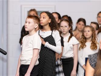 students lined up for diploma 