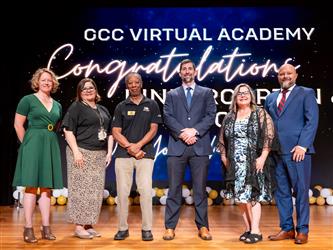 gcc staff and board on stage 