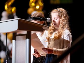woman speaking at podium