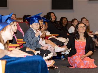graduating student clapping