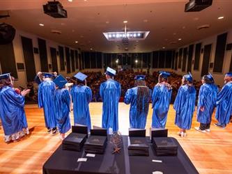 grad students lined on stage
