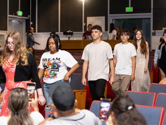 students walking to stage