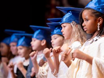 graduates on stage 