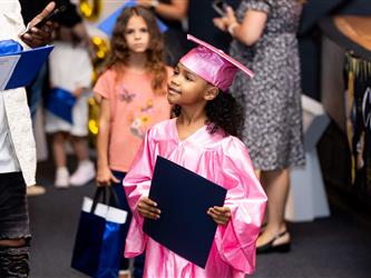 student with their diploma