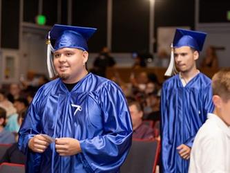 student walking to stage