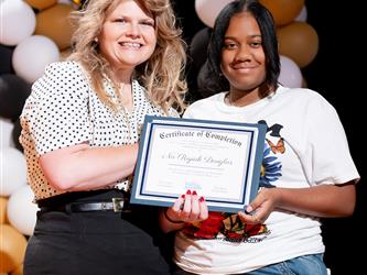 student receiving their certificate