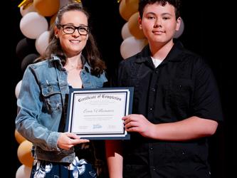 student receiving their certificate