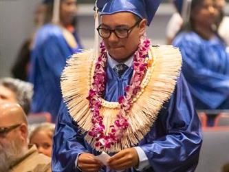 student walking to stage