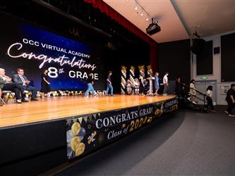 students walking on stage