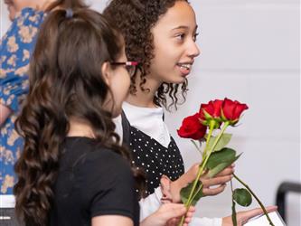 student holding roses