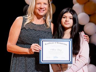 student receiving their certificate