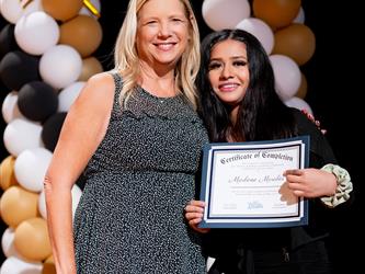 student receiving their certificate