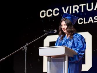 student at podium speaking to class