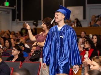 student walking to stage