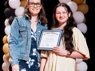 student receiving their certificate