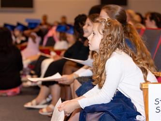 student in crowd watching  
