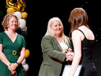 student receiving their certificate