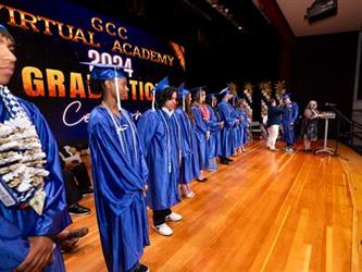 grad students lined on stage