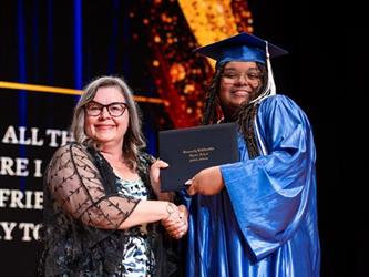 student with diploma 