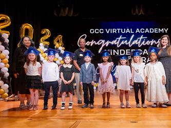 students lined up on stage 
