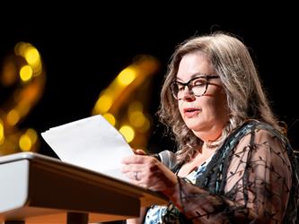woman speaking at podium