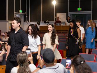students walking to stage
