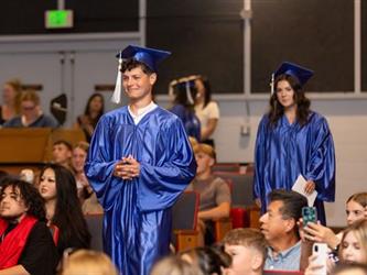 student walking to stage