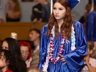 student walking to stage
