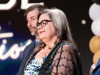 woman speaking at podium