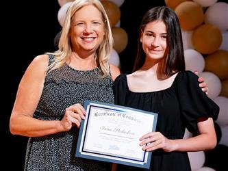 student receiving their certificate