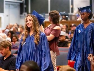 student walking to stage