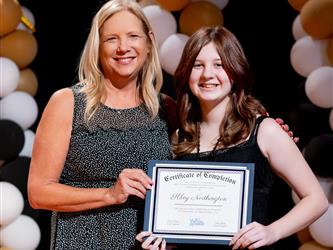 student receiving their certificate